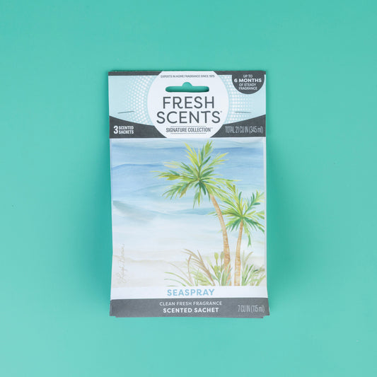 Fresh Scents Seaspray - Sachet 3pk features palm trees by the ocean in blue and turquoise on a teal background, delivering flameless fragrance and long-lasting freshness.