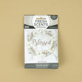 Load image into Gallery viewer, Fresh Scents Blessed Wreath 3pk sachets feature a floral wreath on a light wood background with “Blessed” scripted at the center. Enjoy long-lasting, flameless fragrance in any space.