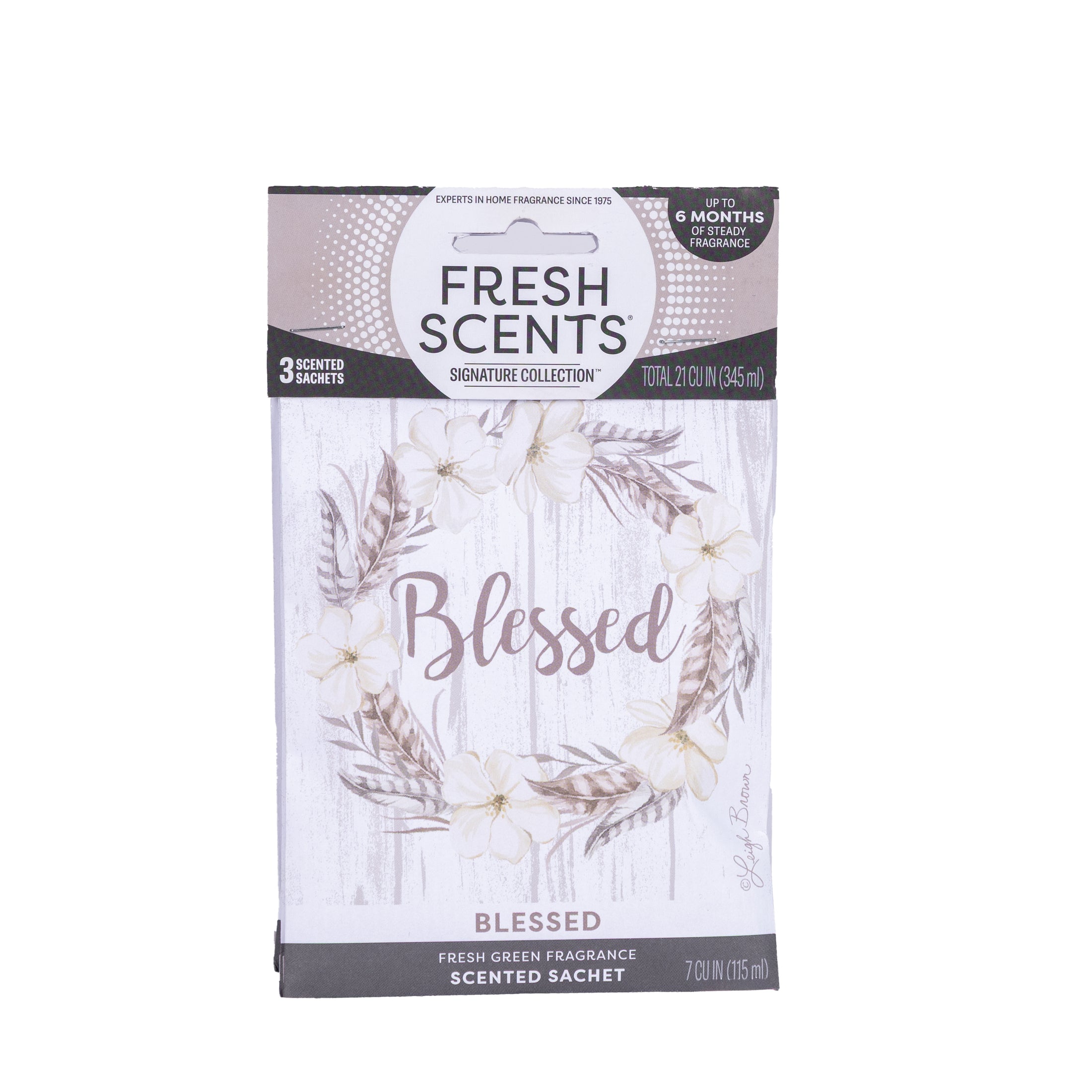 Fresh Scents Blessed Wreath 3pk scented sachets offer a long-lasting air freshener, featuring cream flowers and greenery around "Blessed" on a white wood background.