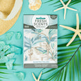 Load image into Gallery viewer, The Fresh Scents Painted Palm - Sachet 3pk features a palm design and offers flameless fragrance, shown on a turquoise background with sea stars, palm leaves, sea glass, and a straw hat for a tropical vibe.
