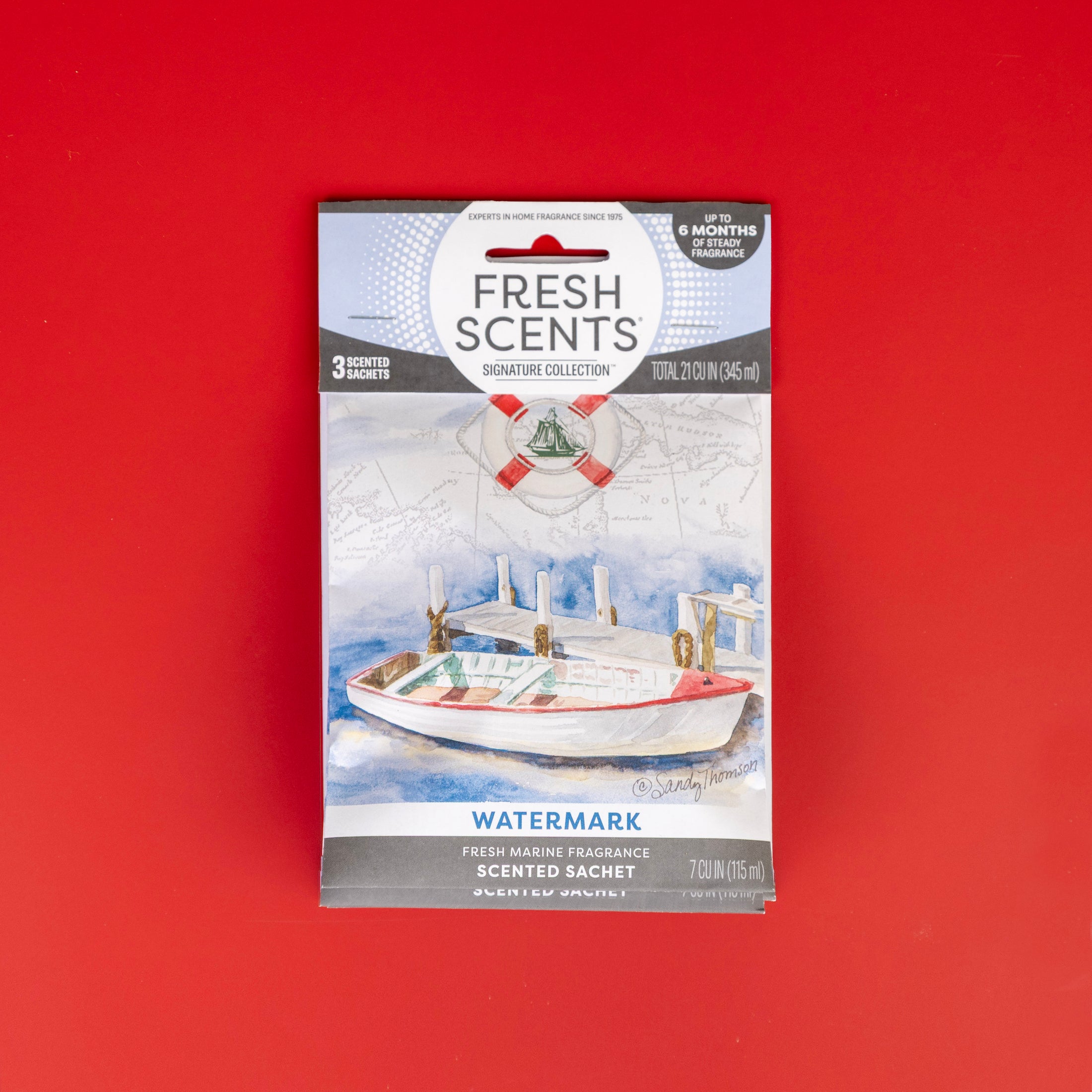The Fresh Scents Watermark - Sachet 3pk features a nautical design with a watercolor boat and life preserver, offers flameless fragrance, and is shown on a vibrant red background.