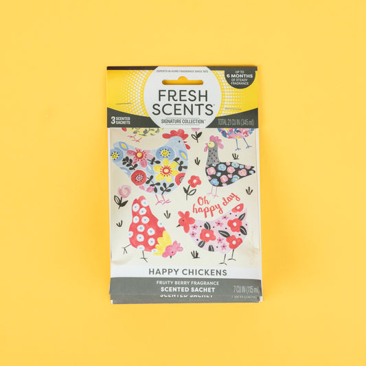 The Fresh Scents Happy Chicken Sachet 3pk features colorful chickens and flowers on yellow. Enjoy a fruity berry scent that lasts up to 4 months with this flameless air freshener.