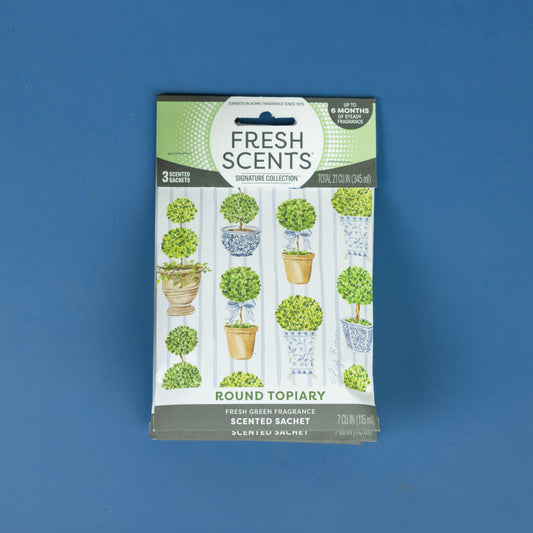 Enjoy the crisp green scent of Fresh Scents Round Topiary - Sachet 3pk, featuring three long-lasting, flameless fragrance sachets with topiary plant designs on a blue background.